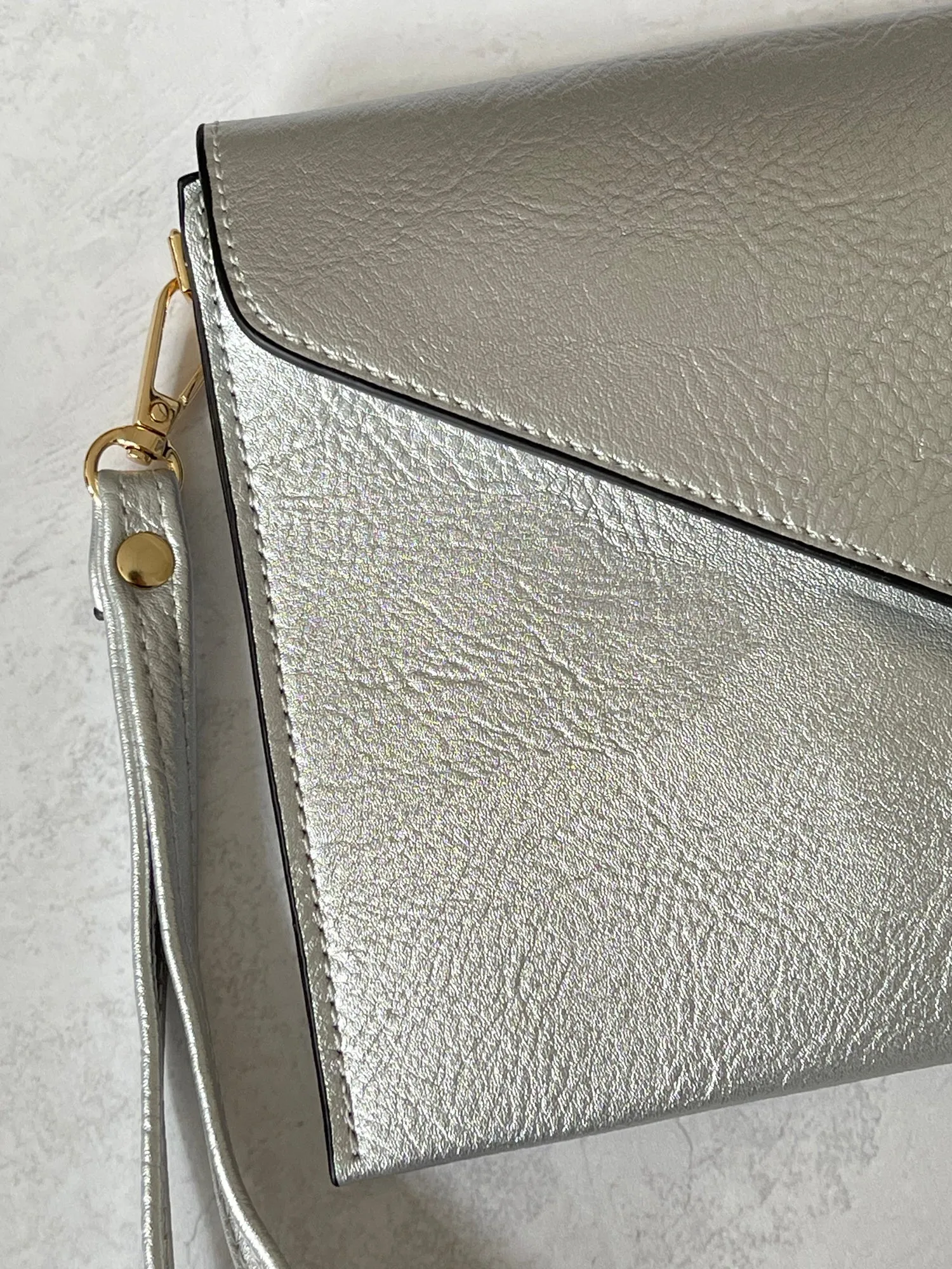 METALLIC SILVER OVER-SIZED ENVELOPE CLUTCH BAG WITH LONG CROSS BODY AND WRISTLET STRAP